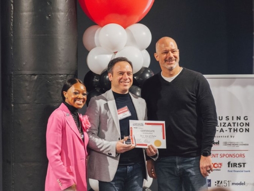 A group of people posing for a photo Description automatically generated